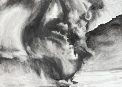 Charcoal drawing of a volcano erupting in the sea forming new lan mass by Claire Cansick